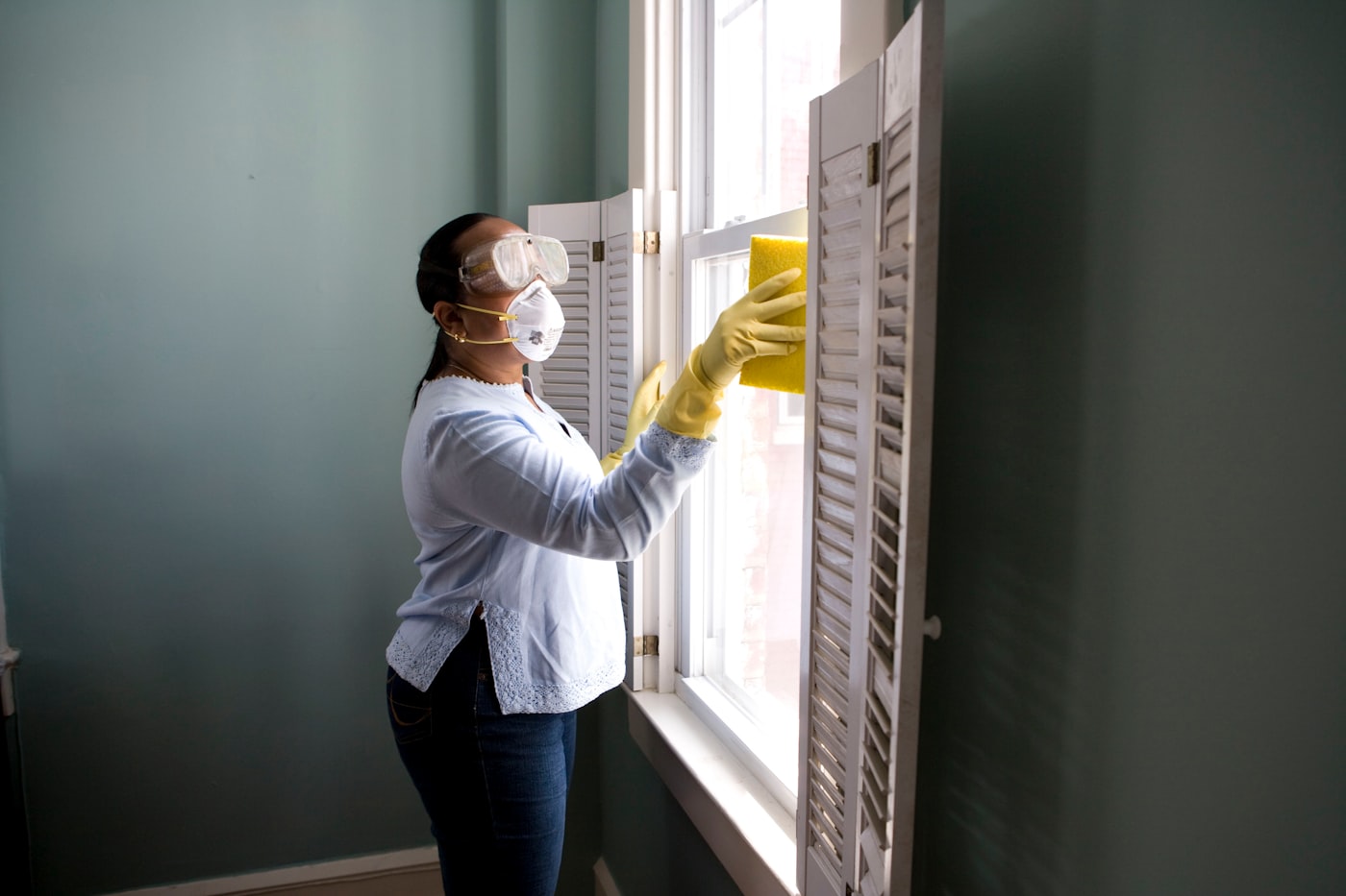 Renovation crew consulting with a homeowner in a kitchen, illustrating contractor trust and service