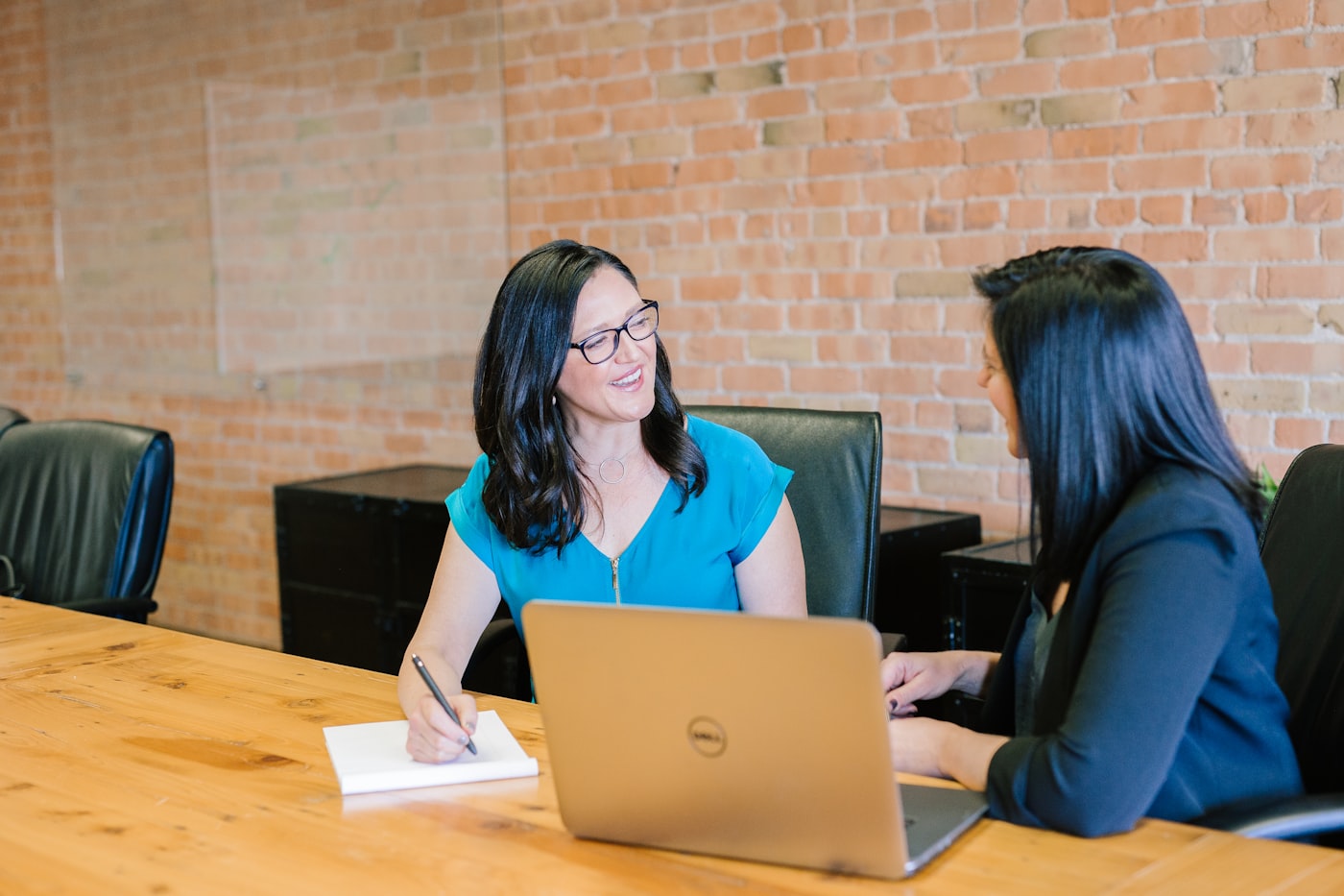 HVAC business owner comparing local SEO pricing and lead reports on a laptop