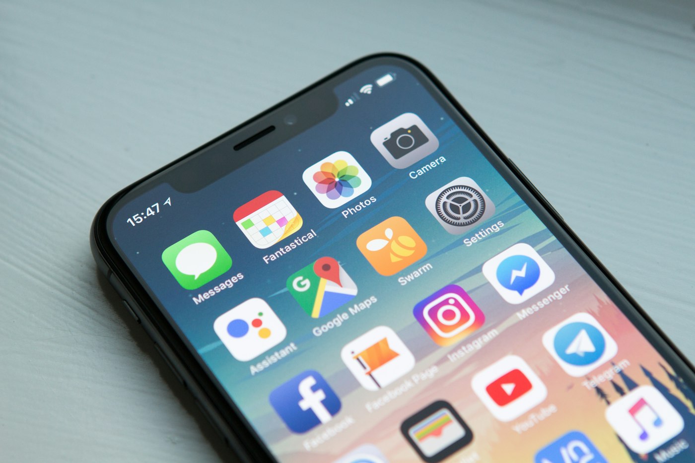 Person searching for a therapist on a smartphone, showing why mobile-friendly practice websites matter